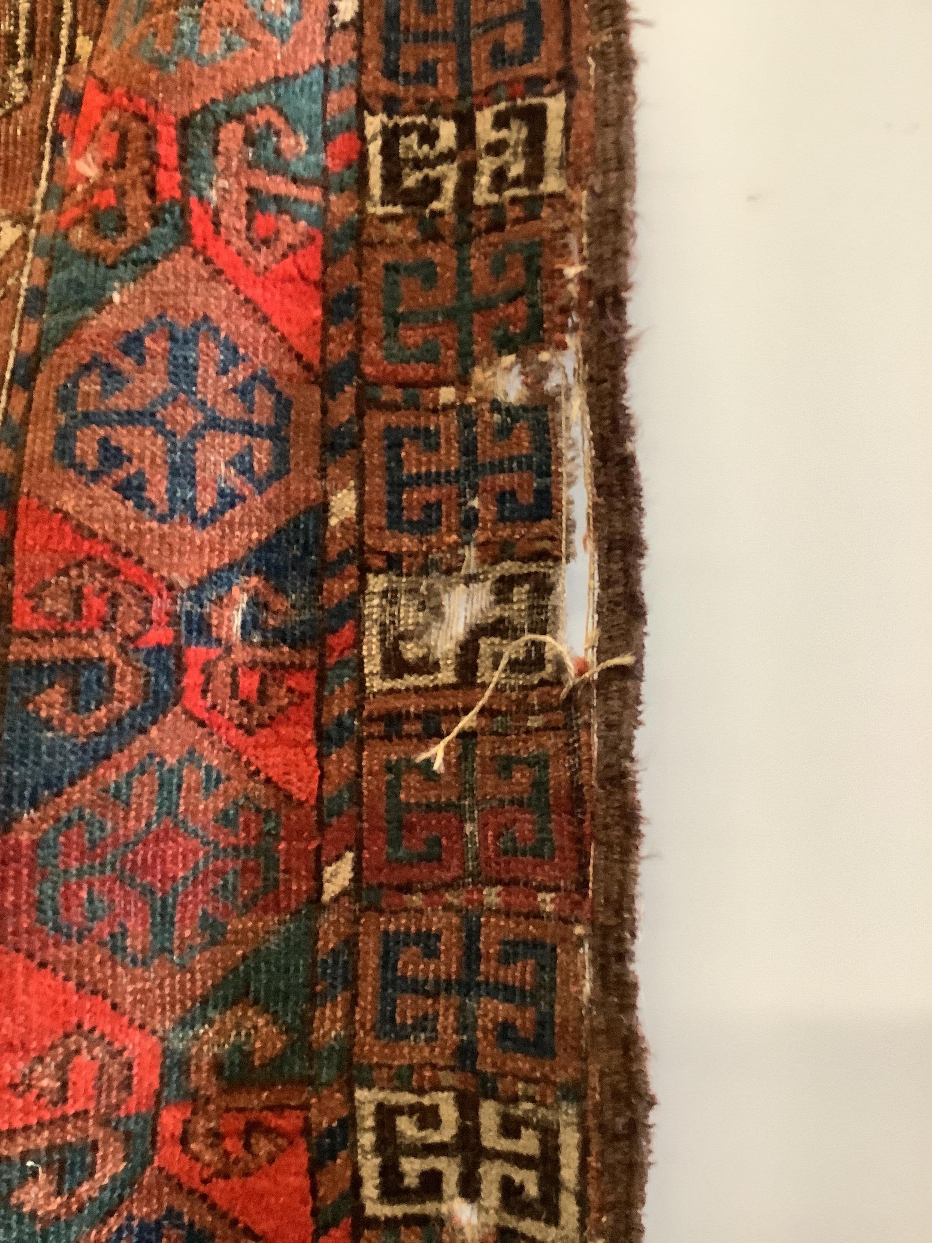 A near pair of antique Turkomen rugs, larger 180 x 134cm. Condition - fair